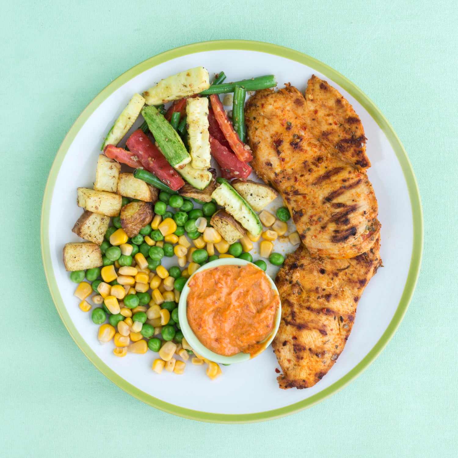 Grilled Chicken with Sautéed Vegetables, potatoes, sweet corn & peas